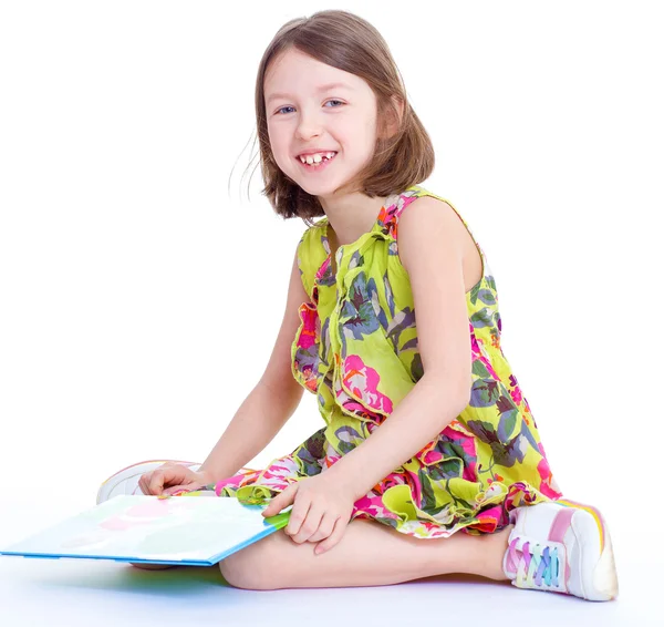 Creative young girl looking photo album. — Stock Photo, Image