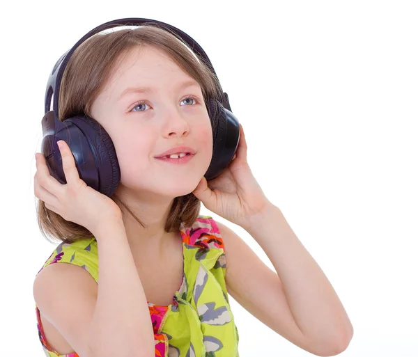 Маленькая девочка слушает музыку . — стоковое фото