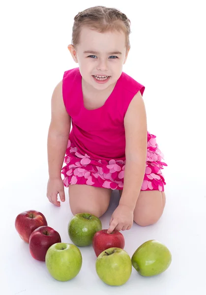 Little girl with apple — Stock Photo, Image