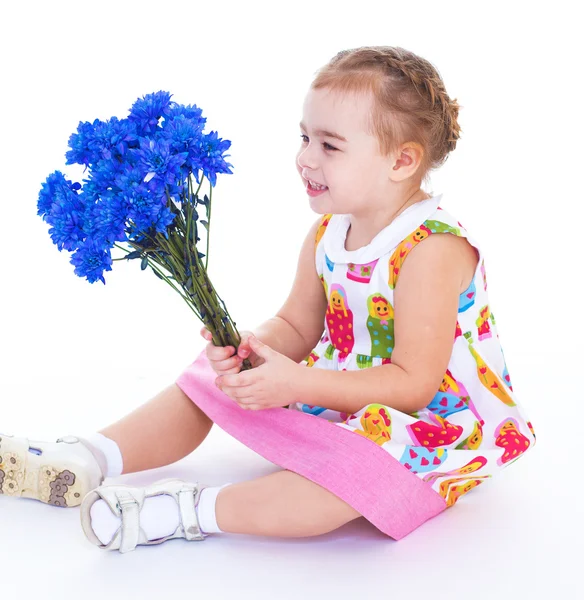 Little girl with blue flowers — Stock Photo, Image