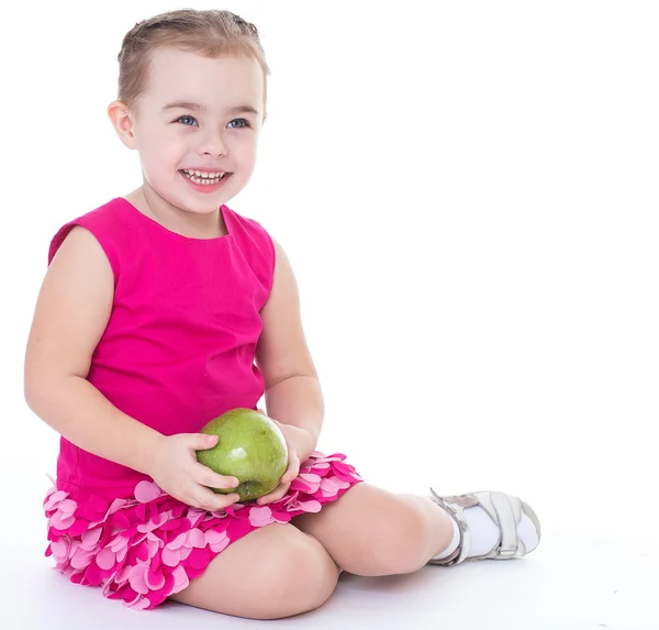 Little girl with apple Stock Picture