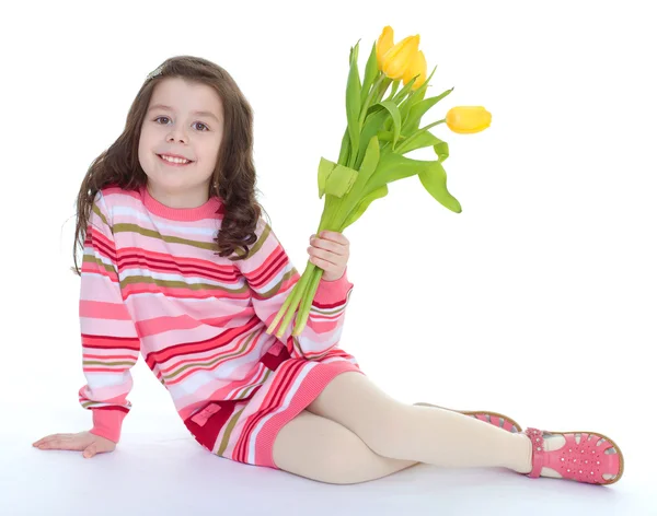 Charming schoolgirl sitting on the floor — Stock Photo, Image