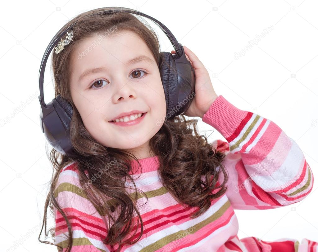 Charming and very musical little girl dancing. Stock Photo by ©lotosfoto1 43547857
