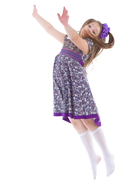 Girl jumping spinning and waving hands — Stock Photo, Image