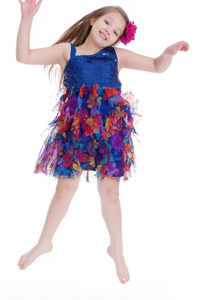 Girl jumping spinning and waving hands — Stock Photo, Image