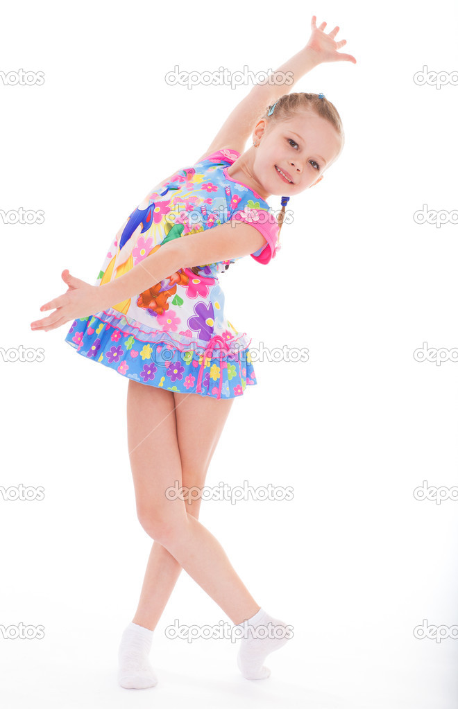 Charming little girl in short dress. Stock Photo by ©lotosfoto1