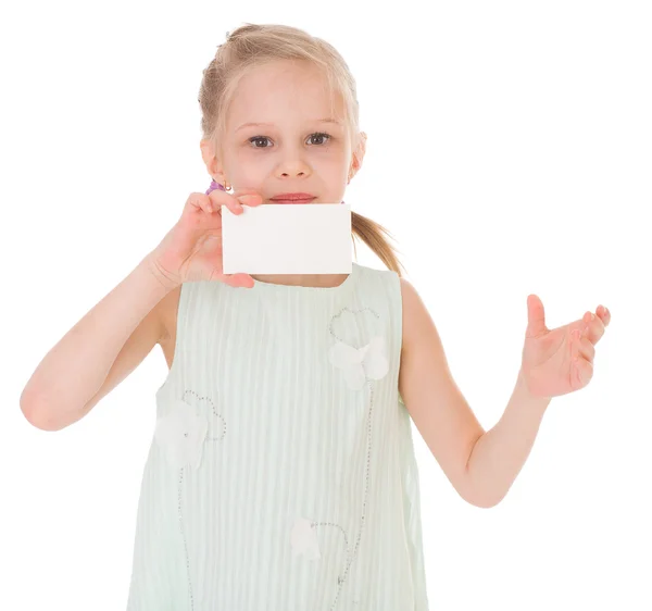 Cheerful little girl with white blank — Stock Photo, Image