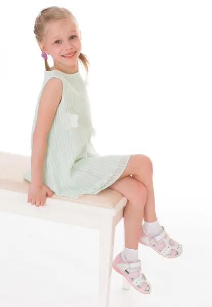 Portrait of sitting little girl. — Stock Photo, Image
