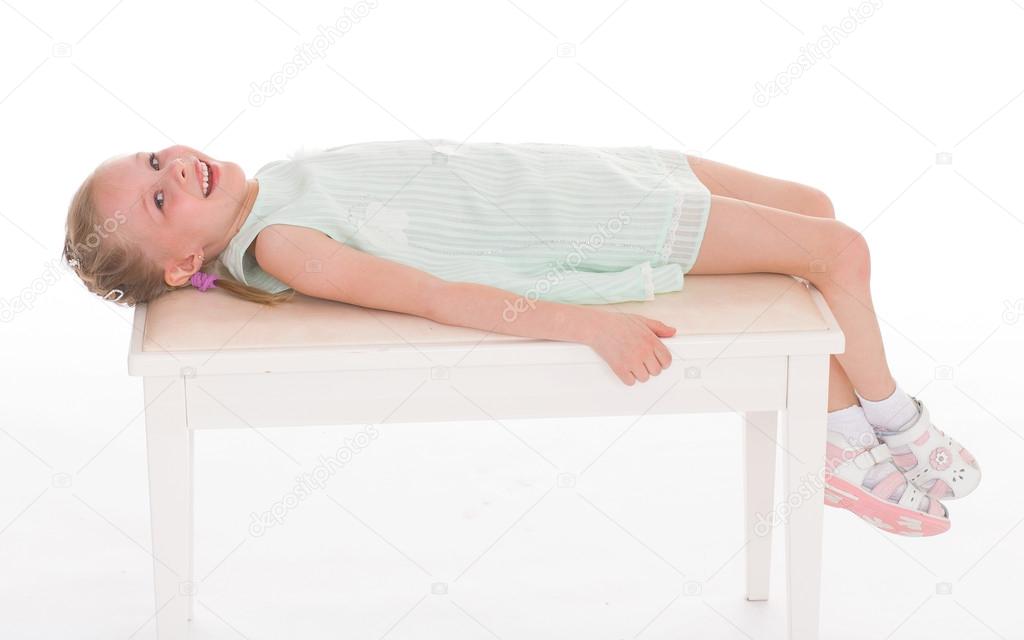 Portrait of a little girl lying. — Stock Photo © lotosfoto1 #44490171