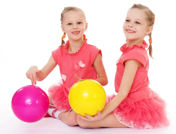 Two charming sisters love to play ball. — Stock Photo, Image
