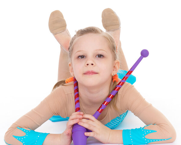 cute girl gymnast with sports maces.