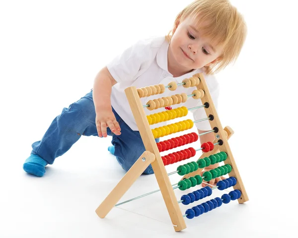 Little boy thinks the accounts — Stock Photo, Image