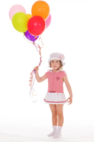 Meisje met kleurrijke ballonnen. — Stockfoto