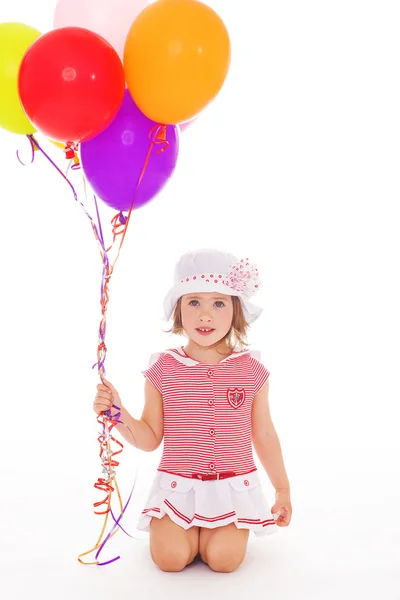 Meisje met kleurrijke ballonnen. — Stockfoto
