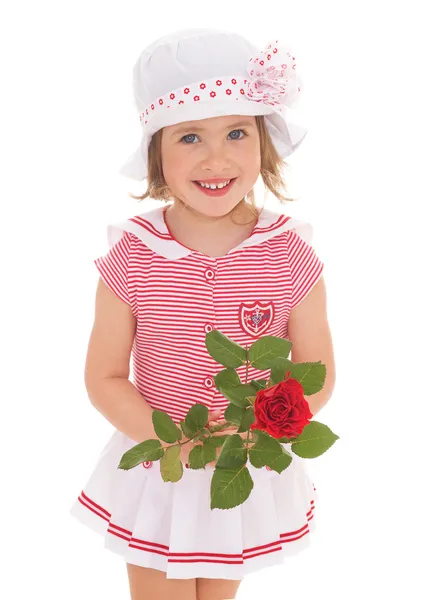 Charmant klein meisje met rode rose bloem — Stockfoto