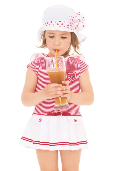 Girl drinking a glass of juice. — Stock Photo, Image