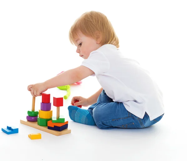 Little boy in the classroom at Montessori environment. Stock Image