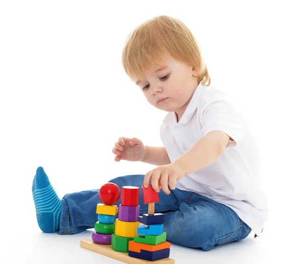 Little boy in the classroom at Montessori environment. Royalty Free Stock Photos