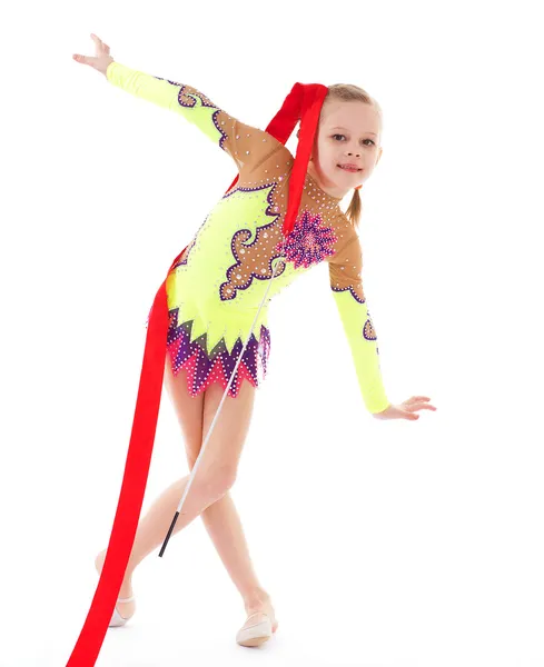 Adorable little gymnast dancing with ribbon — Stock Photo, Image