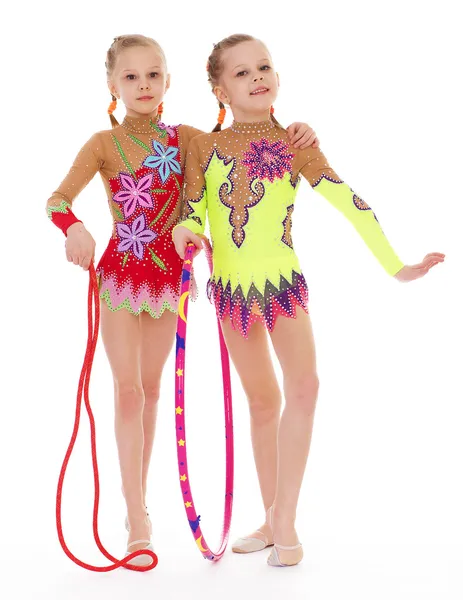 Funny young girl gymnasts show exercise. — Stock Photo, Image