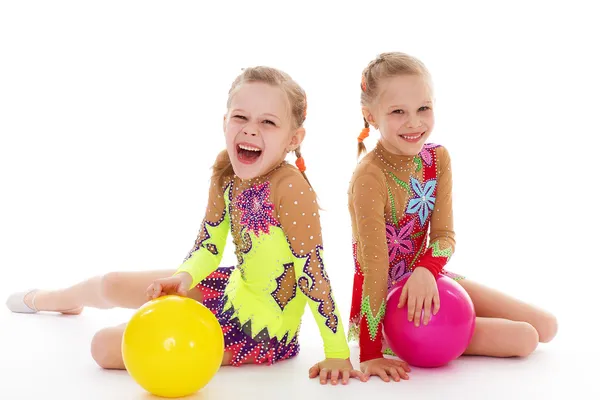 Two charming sisters love to play ball. — Stock Photo, Image