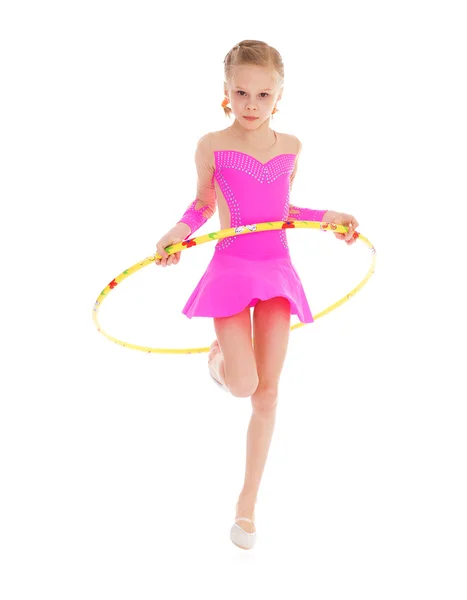 Beautiful little gymnast with the hoop — Stock Photo, Image