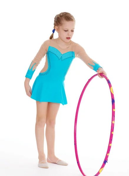 Beautiful little gymnast with the hoop — Stock Photo, Image