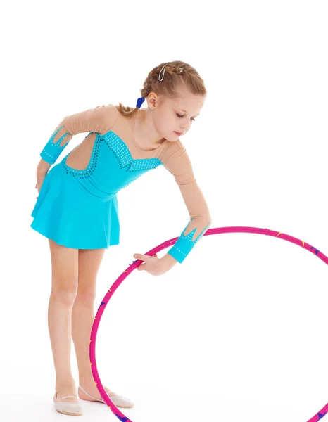 Beautiful little gymnast with the hoop — Stock Photo, Image