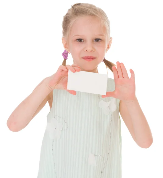 Cheerful little girl with white blank — Stock Photo, Image