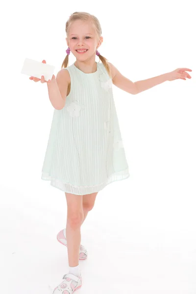 Cheerful little girl with white blank — Stock Photo, Image