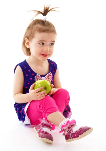 Little girl with apple. — Stock Photo, Image