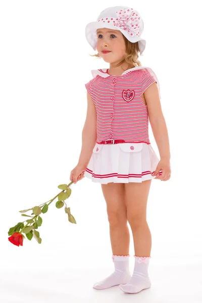 Charmig tjej med en ros i handen. — Stockfoto