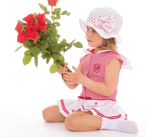 Charmig tjej med en ros i handen. — Stockfoto
