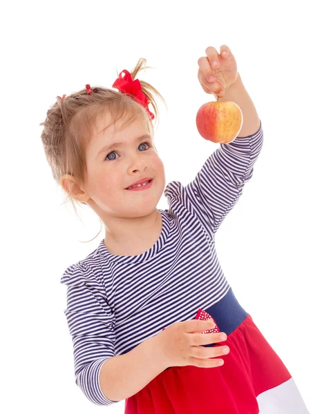 Charming little girl with red apple. — Stock Photo, Image