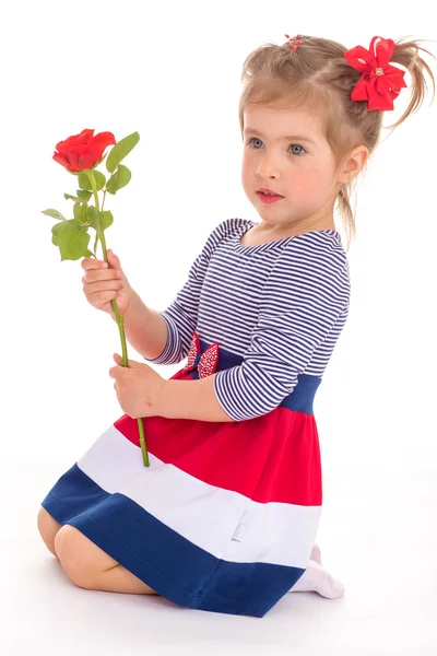 Fashionable little girl with a rose. — Stock Photo, Image