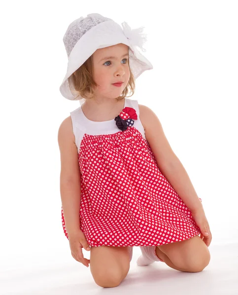 Cheerful little girl in a pink dress. — Stock Photo, Image