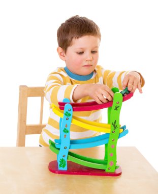 little boy playing at the table
