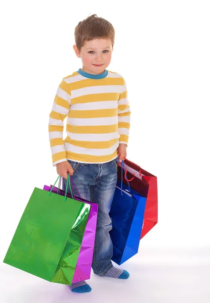 Little boy with packages. — Stock Photo, Image