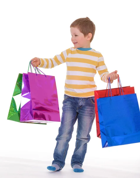 Little boy with packages. — Stock Photo, Image