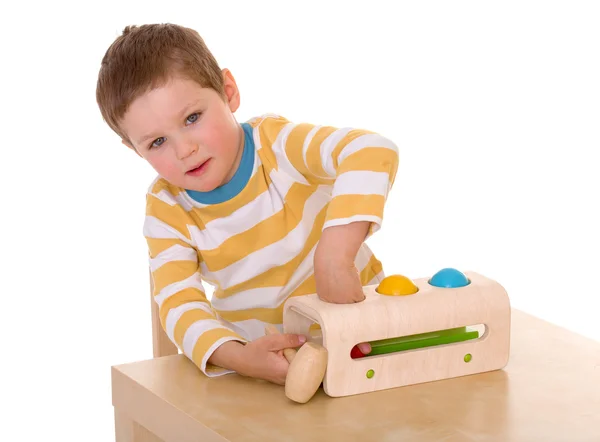 Menino brincando na mesa — Fotografia de Stock