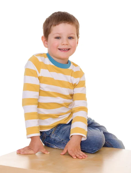 Little boy is sitting on the table. — Stock Photo, Image