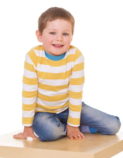 Little boy is sitting on the table. — Stock Photo, Image