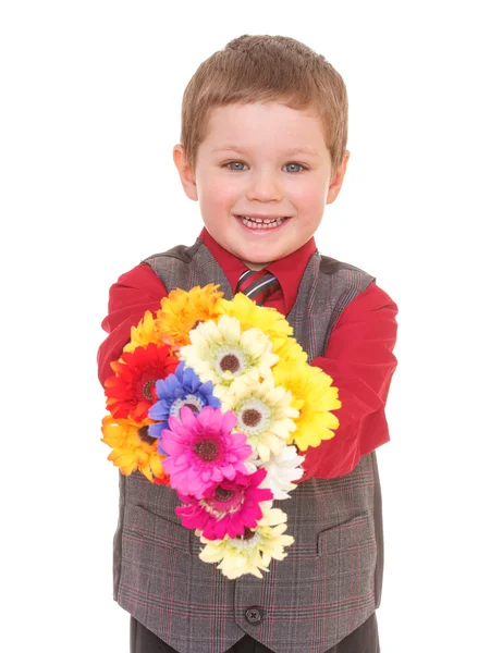 Niño pequeño con flores. —  Fotos de Stock