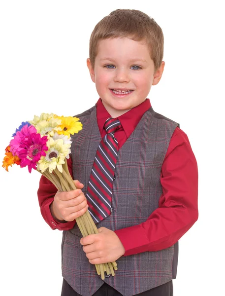 Mały chłopiec z kwiatami. — Zdjęcie stockowe