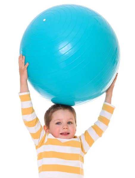 Little boy with a big ball. Stock Image