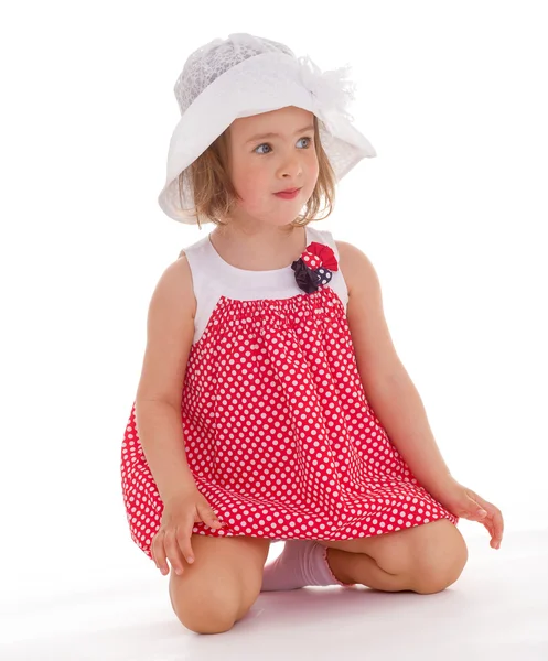 Cheerful little girl in a pink dress. — Stock Photo, Image