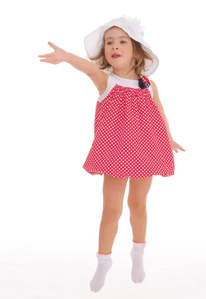 Fashionable little girl in a pink dress. — Stock Photo, Image