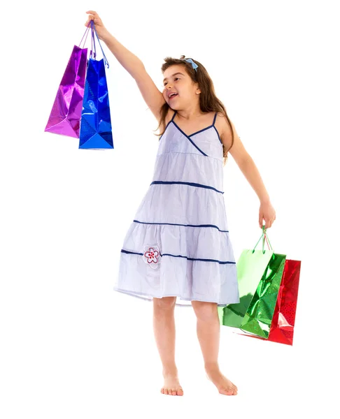 Little girl with packages — Stock Photo, Image