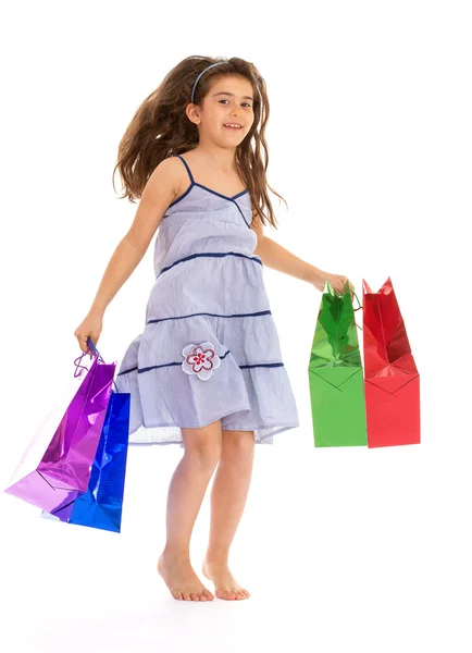 Little girl with packages — Stock Photo, Image