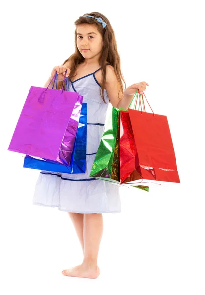 Little girl with packages — Stock Photo, Image